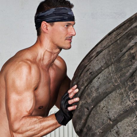 image of a Black and Gray Camo Headband on a model who is working out
